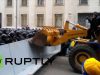Ukraine: Protesters throw flares as a digger is driven through police barricade